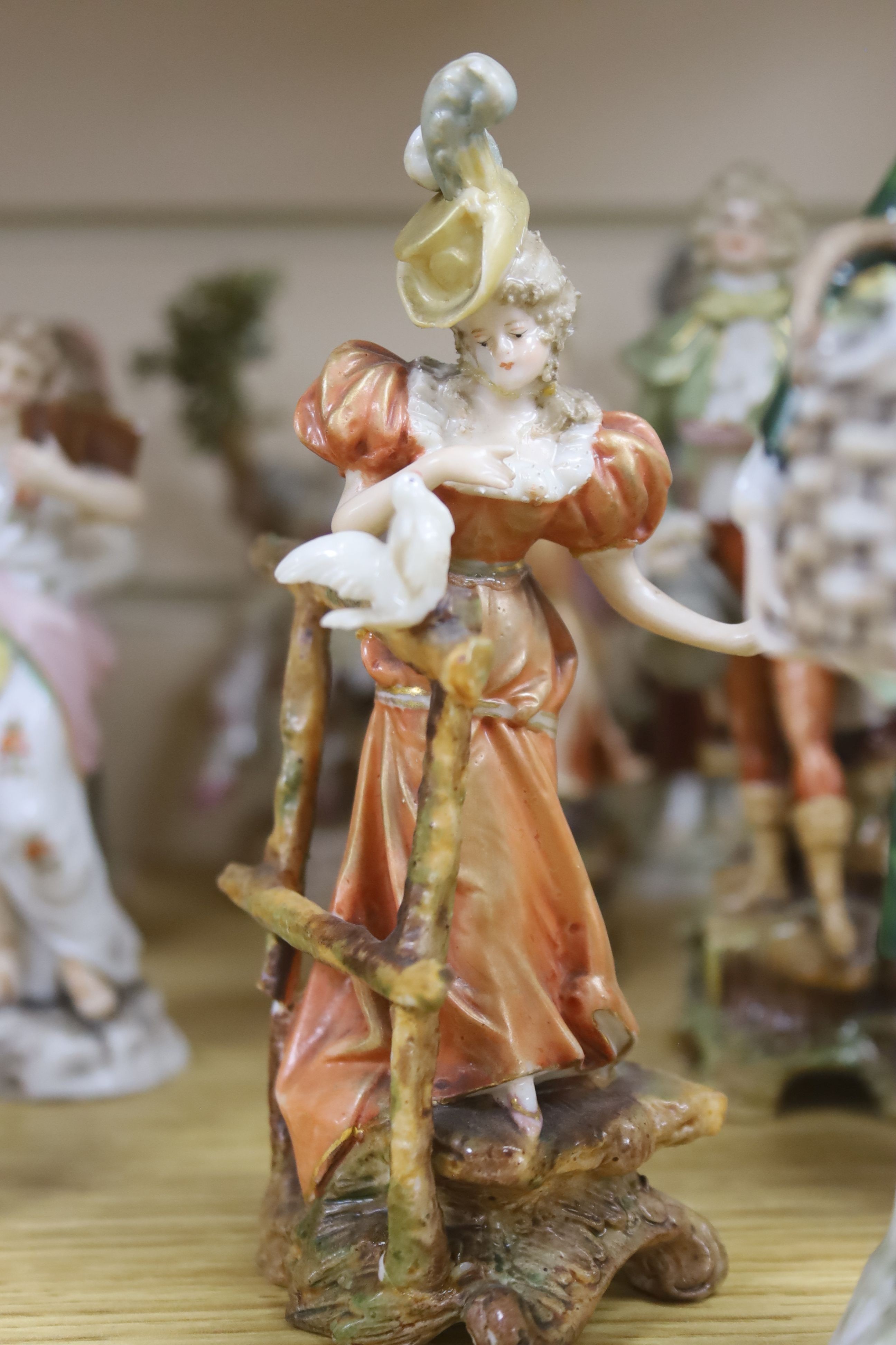A collection of mixed Continental porcelain figurines (23)